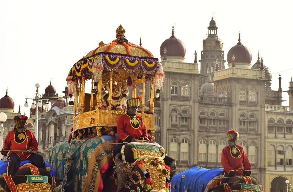 The golden howdah carried past Amba Vilas Palace